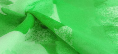 Abstract green silk chiffon fabric. Art mockup of spring green color taffeta silk fabric. Texture. background. template.