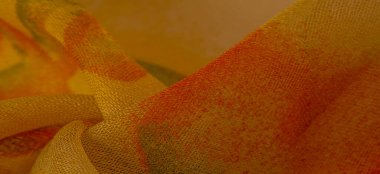 yellow fabric texture with abstract red print. luxury as abstract background. Luxury Christmas background. Fabric, delicate. Smooth elegant