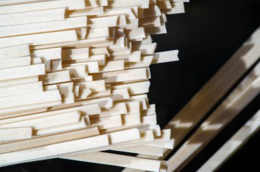 Linguine pasta. Linguini is usually made from both white flour and whole grains, but it was originally made from durum wheat. originated in Italy and is based on more traditional pastas.