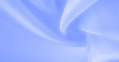 Mavi ipek kumaş, pürüzsüz mavi ipek ya da lüks saten kumaş, düğün arka planı olarak doku. Lüks arka plan tasarımı. Retro biçimi.