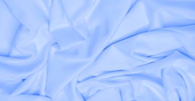 Beyaz ipek kumaş. Doku. Geçmişi. Şablon. Dupioni ipek kumaşının parlak bir parıltısı ve yatay hareket eden karakteristik küçük kıvrımları vardır. Yumuşak kıvrımlar içinde uzanır