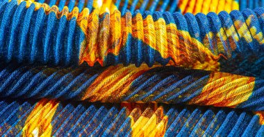 silk crimped. Blue, yellow, brown, burgundy colors. Ruffled silk fabric in vintage style. Floral pattern for elasticity. Opens the gathered fabric into pleasing and flattering folds.