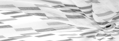 Siyah geometrik eşkenar dörtgen şekilli beyaz ipek kumaş. Karanlık. Geçmişi. Şablon.