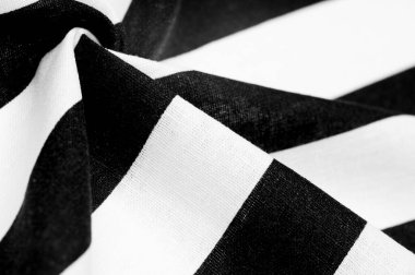 Pamuk kumaş, beyaz ve siyah çizgili. Katı lakonik tasarım. Modern geometrik arka planlar. Arkaplan dokusu