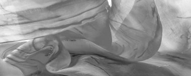 Beyaz arka planda gri benekli siyah beyaz kumaş. Soyut tasarımcı kumaş tasarımcısı. Tasarımın için güzel bir arka plan. Doku. Görüntü. çizim, kalıp, şekil