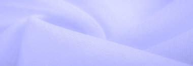 pale blue silk fabric. thin, strong, soft, shiny fiber produced by silkworms. the feel, appearance, or consistency of a surface or a substance. Texture. Background.