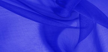 Mavi ipek kumaş dokusu. Pürüzsüz, zarif mavi ipekten ya da saten kumaştan. Lüks kumaş. soyut bir arkaplan olarak kullanılabilir.