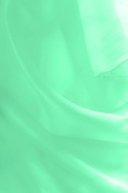 Yeşil soluk ipek kumaş, pürüzsüz kırmızı ipek ya da lüks saten kumaş, düğün arka planı olarak doku. Lüks arka plan tasarımı. Retro biçimi.