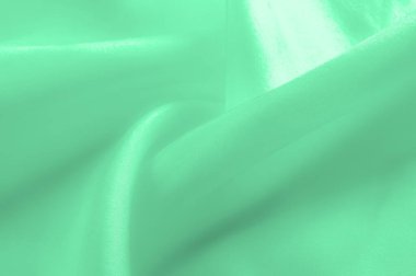 Yeşil soluk ipek kumaş, pürüzsüz kırmızı ipek ya da lüks saten kumaş, düğün arka planı olarak doku. Lüks arka plan tasarımı. Retro biçimi.