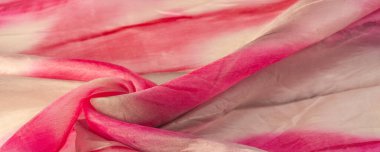 Kırmızı ve bej kumaşlar, bej arkaplanda kırmızı lekeler var. Soyut tasarımcı kumaş tasarımcısı. Tasarımın için güzel bir arka plan. Doku. Görüntü. çizim, kalıp, şekil