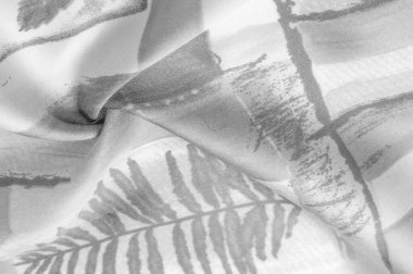 Soyut desenli siyah beyaz kumaş, bitki dallarının izi. Doku. Geçmişi. Şablon.