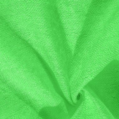 Parlak yeşil malzeme. Bu ipek son derece pürüzsüz ve yumuşak, güzel pürüzsüz bir dokusu var. arkaplan deseni