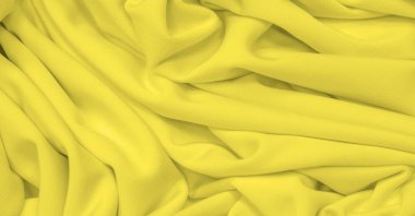 Kumaş sarı ipek. Doku. Geçmişi. Şablon. İpek kumaşın parlak bir parıltısı ve yatay olarak çalışan karakteristik küçük kıvrımları vardır. Yumuşak kıvrımlar içinde uzanır