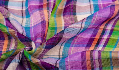 İskoç dokusunun arka plan dokusu, ki bu dokunun adı doğrudan ülkenin kökenini gösterir. Bu materyalin ikinci ve daha doğru adı tartan..