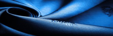 silk fabric dark blue, grayish blue, small pattern, pattern, which is a combination of lines, colors, shadows. texture background, pattern