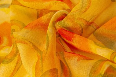 yellow fabric texture with abstract red print. luxury as abstract background. Luxury Christmas background. Fabric, delicate. Smooth elegant