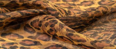 İpek kumaş, leopar derisi, kahverengi-sarı siyah tonlar, projeleriniz için sıcak Afrika safarisi, doku arka planı, desen