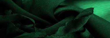 Doku. Geçmişi. Yeşil ipek kumaş, yukarıdan görünüyor. Pürüzsüz yeşil ipek ya da saten lüks kumaş dokusu, kopyalama alanı olan soyut bir arkaplan olarak kullanılabilir.