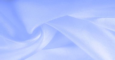 Mavi ipek kumaş, pürüzsüz mavi ipek ya da lüks saten kumaş, düğün arka planı olarak doku. Lüks arka plan tasarımı. Retro biçimi.