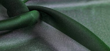 İpek kumaş, şeffaf, dalga gibi yeşil. Turkuazın tonlarıyla. Arkaplan dokusu, duvar kağıdı deseni