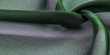 İpek kumaş, şeffaf, dalga gibi yeşil. Turkuazın tonlarıyla. Arkaplan dokusu, duvar kağıdı deseni