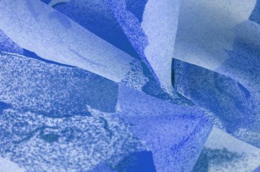 Abstract blue silk chiffon fabric. Artistic layout in denim silk taffeta color. Texture. background. template.