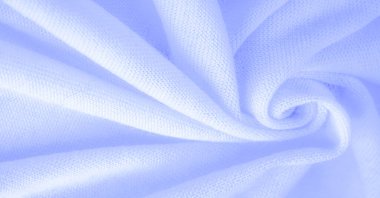 Mavi kumaş, lüks kumaşın soyut arkaplanı ya da dalgaların sıvı ipek dokusu ya da dalgalı kıvrımlar. arka plan ya da zarif duvar kağıdı tasarımı. Pamuk dokusu, doğal kumaş ve boya.