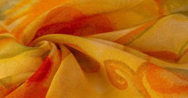 yellow fabric texture with abstract red print. luxury as abstract background. Luxury Christmas background. Fabric, delicate. Smooth elegant