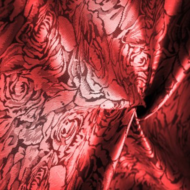 red silk fabric, with a floral pattern, unusually pleasant visual sensations: slippery, coolness, softness; beautiful appearance, unique luster;