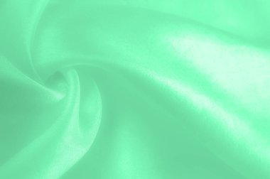 Yeşil soluk ipek kumaş, pürüzsüz kırmızı ipek ya da lüks saten kumaş, düğün arka planı olarak doku. Lüks arka plan tasarımı. Retro biçimi.