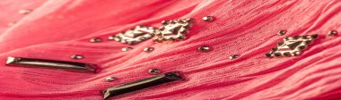 Silk pattern, Silk pattern, red fabric with glued decorative faceted stones. texture background with bright colorful stones, texture background design