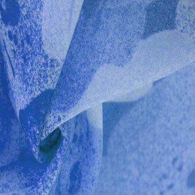Abstract blue silk chiffon fabric. Artistic layout in denim silk taffeta color. Texture. background. template.
