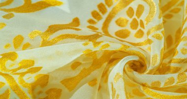 İpek kumaş, zarif renklerde altın pasteller beyaz arka planda, basılmış altın desenli fotoğraf. Doku, desen, koleksiyon