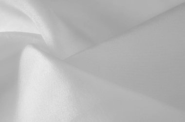 Beyaz ipek kumaş, pürüzsüz beyaz ipek ya da lüks saten kumaş, düğün arka planı olarak doku. Lüks arka plan tasarımı. Retro biçimi.