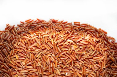 Red rice, gold and black (also called purple) are all whole rice, but with a different pigmented outer layer. Product photography.
