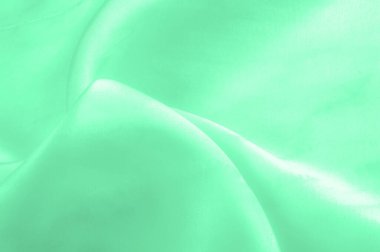 Yeşil soluk ipek kumaş, pürüzsüz kırmızı ipek ya da lüks saten kumaş, düğün arka planı olarak doku. Lüks arka plan tasarımı. Retro biçimi.