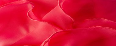 Kırmızı ipek katlanmış kumaş arka plan, afiş veya kapak tasarımı. Poster için lüks tekstil dekorasyonu yumuşak saten dalgalı kırmızı kumaş, poster dokusu. Geçmişi. Desen.