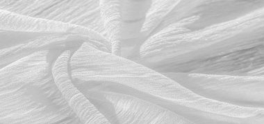 İpek kumaş. Beyaz buruşuk kumaşın dokusu. Beyaz buruşuk, dalgalı yüzey dokusu. Yakın çekim, yumuşak odaklanma. arkaplan, kalıp