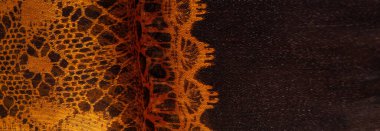 Tekstil malzemesinden kahverengi arka plan. dantel kumaş. Doğal kehribar dokusu. Doku, arkaplan, desen.