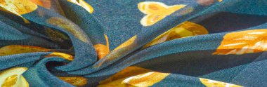 İpek kumaş, mavi ve sarı sonbahar yaprakları. Doku, arkaplan deseni