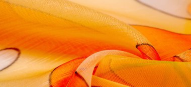 red, white and yellow geometric colors, made of fine viscose silk. organza pattern. Texture. Background fine knitted fabric - light transparent,
