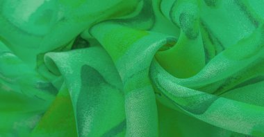 green fabric texture with abstract green print. luxury as abstract background. Luxury Christmas background. Fabric, delicate.