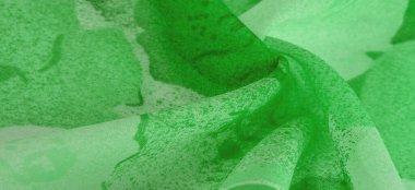 Abstract green silk chiffon fabric. Art mockup of spring green color taffeta silk fabric. Texture. background. template.