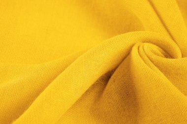Sarı ince taneli doku. Sarı ipek keçeli kadife kumaş. Doku arka planı. Arkaplan kumaşı