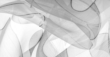 siyah ve beyaz, tek renkli geometrik renkler, ince yapışkan ipekten yapılmış bir peçe gibi. Organza deseni. İnce örülmüş kumaş - şeffaf,