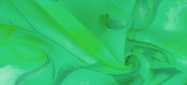 green fabric texture with abstract green print. luxury as abstract background. Luxury Christmas background. Fabric, delicate.