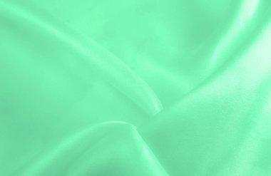 Yeşil soluk ipek kumaş, pürüzsüz kırmızı ipek ya da lüks saten kumaş, düğün arka planı olarak doku. Lüks arka plan tasarımı. Retro biçimi.