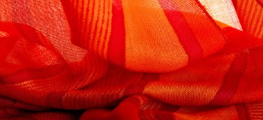 fabric red-burgundy, with a print of yellow lines. wine from Burgundy fabric color Texture. Background.