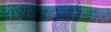 İskoç dokusunun arka plan dokusu, ki bu dokunun adı doğrudan ülkenin kökenini gösterir. Bu materyalin ikinci ve daha doğru adı tartan..