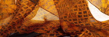 Kahverengi dantel kumaş, kehribar ve siyah kumaş karışımı. Kehribar, doku, arkaplan, desen.